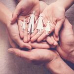 School Transition Alleged – Family Cut Off Hands holding a paper cutout family