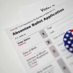 Absentee ballot application with patriotic button