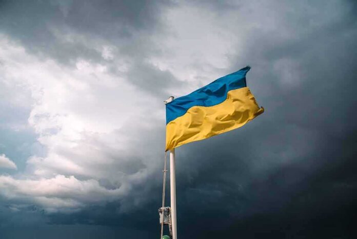 shutterstock_1653837706 Ukrainian flag waving against a stormy sky