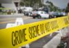 Family Massacre Sparks Deadly Interstate Pursuit crime scene tape stretches across a blocked city street