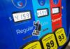 Sticker Shock: Labor Day Gas Smashes Record Gas pump with prices and sticker on the Extra button