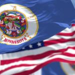 Feeding Our Future Fallout Engulfs Flanagan Minnesota state flag waving in the wind
