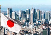 Chokepoint Trap: Japan Deploys Quantum Eyes Japanese flag waving with modern city skyline in background