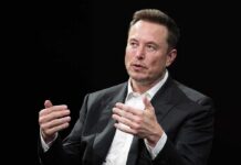 Musk Slams ‘Shallow Empathy’—Victims First man in a suit speaking with hand gestures