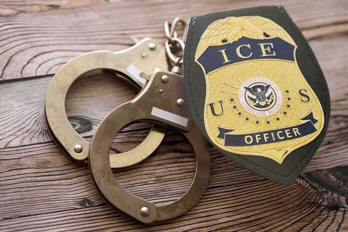 Kyiv,,Ukraine,-,September,17,,2025,Us,Ice,Officer,Badge ICE officer badge and handcuffs on wooden surface