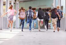DOJ Crackdown Halts Kids’ Gender Drugs group of schoolchildren running with backpacks