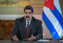 American Victims Named – Maduro Dragged In Nicolás Maduro speaking at a podium with a microphone