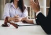 Wrong Man Named – Misfire Shakes Cornell Case Two people in a legal consultation at a desk