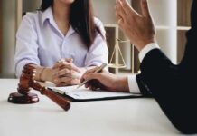 Wrong Man Named – Misfire Shakes Cornell Case Two people in a legal consultation at a desk