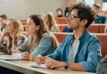 Overhaul: Texas Purge Reshapes College Core students in a lecture hall, including Angela Bettis among the attendees