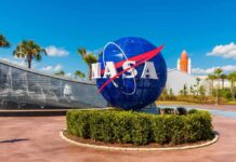 Moon Race Twist: NASA Gambit Keeps Musk, Bezos on Edge NASA globe sign at visitor complex entrance