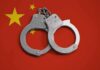 Shanghai Flight Halted – Shocking FBI Grab Handcuffs on red background with yellow stars