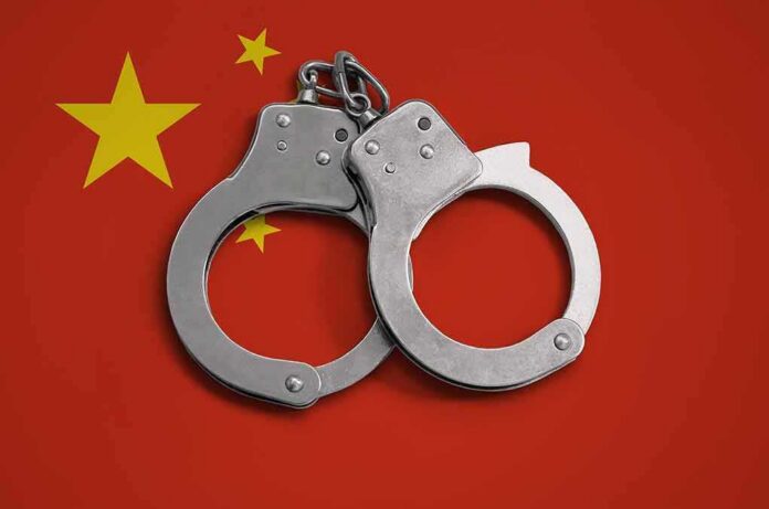 Handcuffs on red background with yellow stars