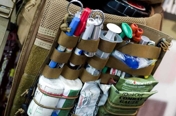 Tactical medical kit with organized supplies on a backpack