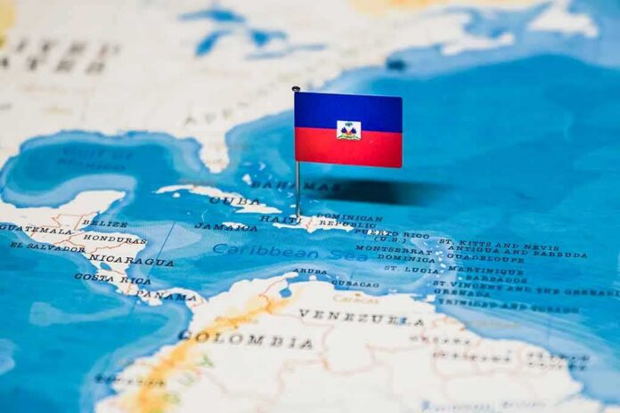 shutterstock_1326826088 Haiti flag pin on a map of the Caribbean