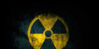 radiation hazard symbol on dark textured background