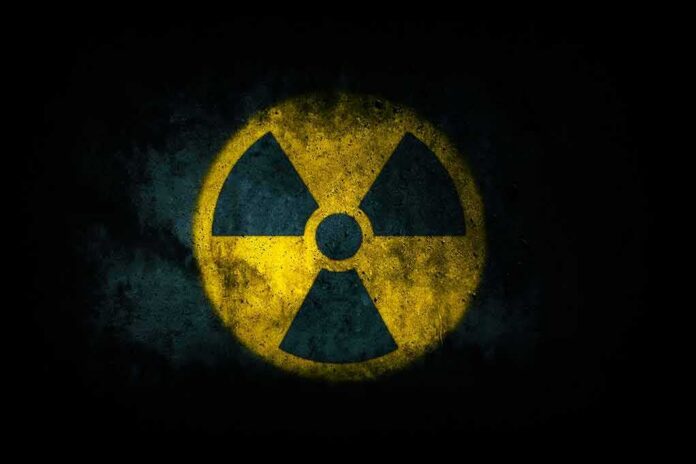 shutterstock_1364464949 radiation hazard symbol on dark textured background