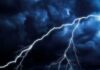 Four Dead – Power Grid Crumples As Isaias Strikes Lightning bolts streak across dark storm clouds