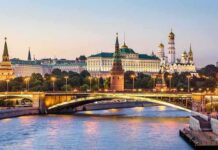 Quiet DC Huddle – Unexpected Moscow Overture Inside Washington Moscow Kremlin skyline at dusk with illuminated bridge over river