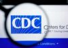 CDC Alert: STD-Style Outbreak Explodes Magnifying glass over CDC logo on a computer screen