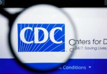 CDC Alert: STD-Style Outbreak Explodes Magnifying glass over CDC logo on a computer screen