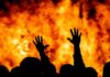 Set Ablaze After Threats – Shocking Miami Turn silhouetted hands raised before a large fire