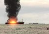 Black Sea Chaos: Drones Hit Two Ships Cargo ship on fire with thick black smoke at sea