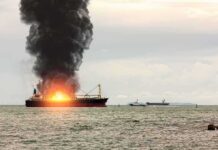 Black Sea Chaos: Drones Hit Two Ships Cargo ship on fire with thick black smoke at sea