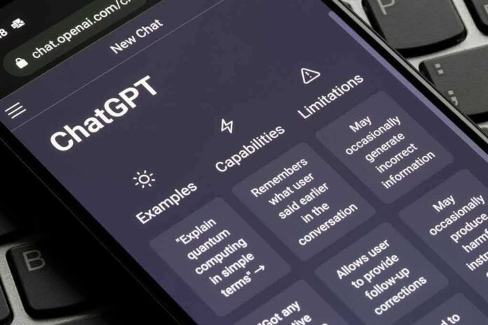 shutterstock_2239373423 Smartphone showing ChatGPT interface on a keyboard