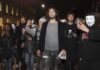 Southwark Showdown: Russell Brand On Trial Russell Brand walking with a crowd at night