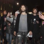 Southwark Showdown: Russell Brand On Trial Russell Brand walking with a crowd at night