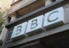 BBC Showdown: Deposition Deadline Traps Trump BBC logo on a building facade